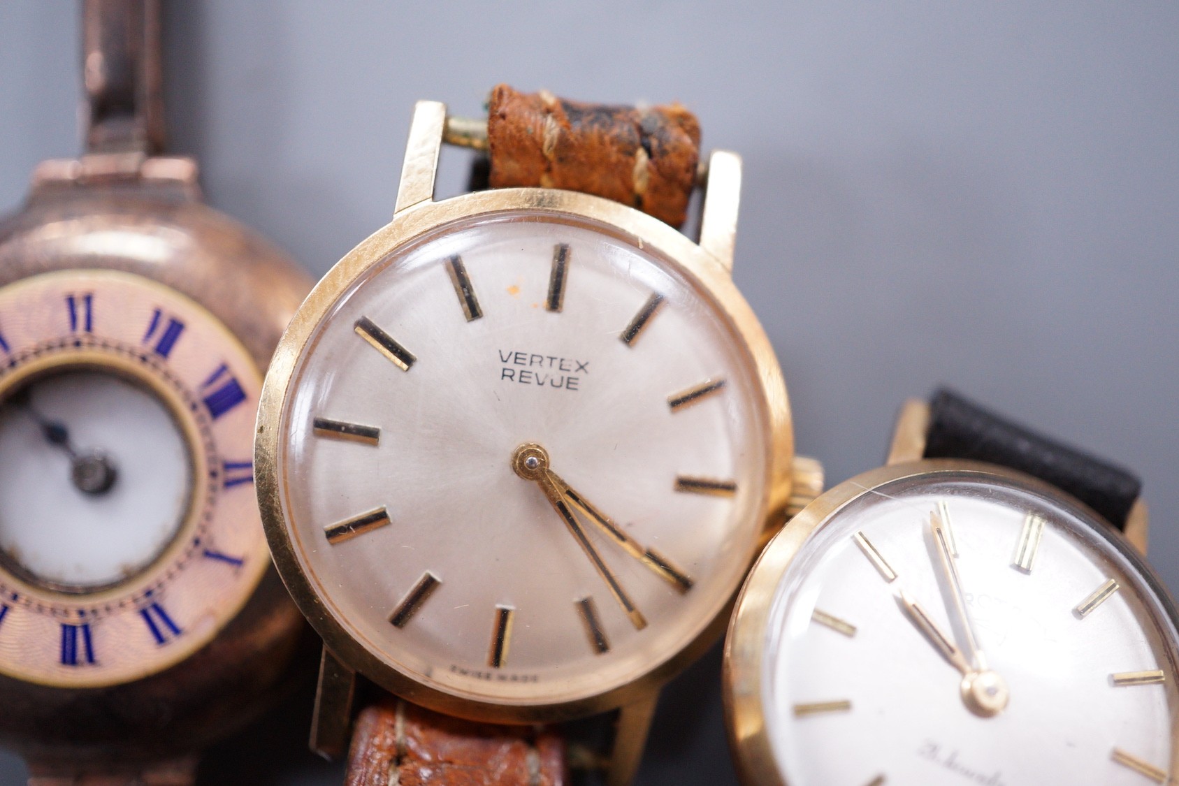 Three assorted lady's 9ct gold manual wind wrist watches, including a Vertex Revue and Rotary on leather straps and half hunter on damaged 9ct bracelet.